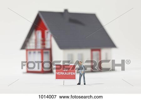 A miniature real estate agent figurine next to a ZU VERKAUFEN (for sale in German) sign View Large Photo Image Stock Photo - A miniature real estate agent figurine next to a ZU VERKAUFEN (for sale in German) sign. Fotosearch