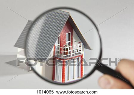 A model house viewed through a magnifying glass View Large Photo Image Stock Photography - A model house viewed through a magnifying glass . Fotosearch