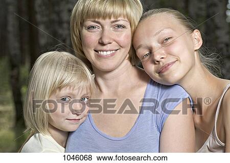 A mother and her two daughters, portrait View Large Photo Image Stock Photo - A mother and her two daughters, portrait. Fotosearch