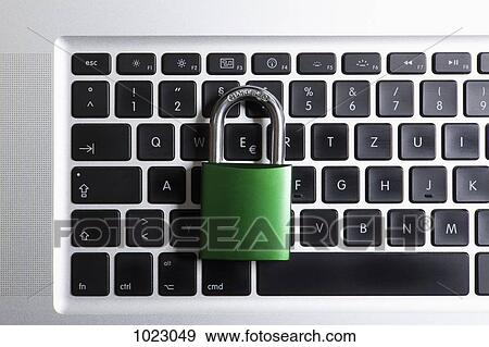 A padlock on top of a laptop keyboard View Large Photo Image Stock Photo - A padlock on top of a laptop keyboard. Fotosearch