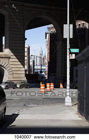 A quiet city street scene in New York, Empire State Building in the background View Large Photo Image Stock Photo - A quiet city street scene in New York, Empire State Building in the background. Fotosearch
