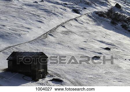 Stock Photo - A remote wooden mountain hut, Graubunden Canton, Switzerland. Fotosearch
