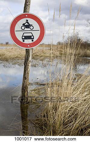 A road sign forbidding motor vehicles View Large Photo Image Stock Photo - A road sign forbidding motor vehicles. Fotosearch