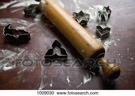 A rolling pin and cookie cutters on a kitchen bench View Large Photo Image Stock Image - A rolling pin and cookie cutters on a kitchen bench. Fotosearch