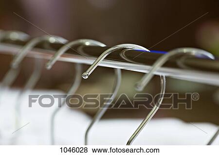 A row of hangers, ECU View Large Photo Image Stock Photo - A row of hangers, ECU. Fotosearch