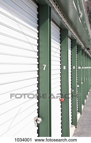 A row of locked storage units at a self storage facility View Large Photo Image Stock Image - A row of locked storage units at a self storage facility. Fotosearch