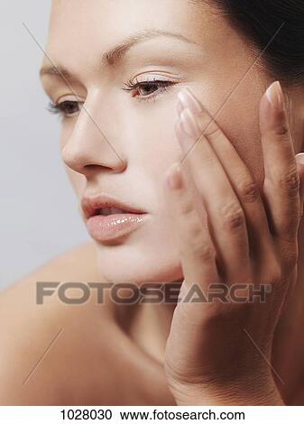 A sensual woman looking away, hand on chin View Large Photo Image Stock Image - A sensual woman looking away, hand on chin. Fotosearch