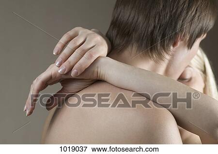 A shirtless couple embracing, head and shoulders View Large Photo Image Stock Photo - A shirtless couple embracing, head and shoulders. Fotosearch