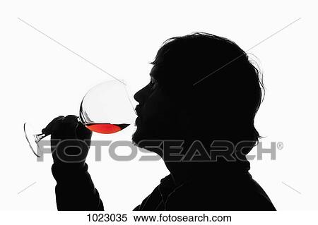 A silhouetted man drinking red wine from a wineglass View Large Photo Image Stock Photography - A silhouetted man drinking red wine from a wineglass. Fotosearch