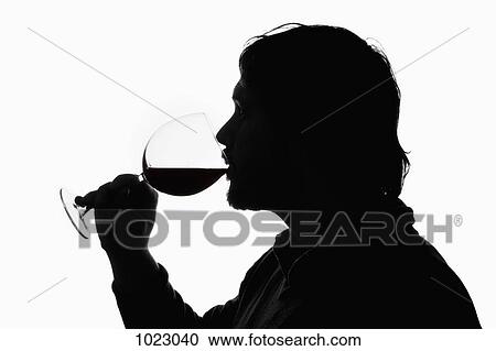 A silhouetted man drinking wine from a wineglass View Large Photo Image Stock Image - A silhouetted man drinking wine from a wineglass. Fotosearch