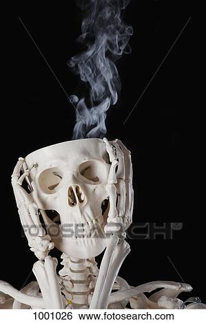 A skeleton with smoke coming out of its skull View Large Photo Image Stock Photograph - A skeleton with smoke coming out of its skull. Fotosearch