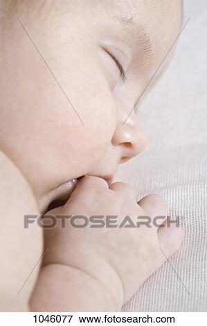 A sleeping baby, close-up View Large Photo Image Stock Photo - A sleeping baby, close-up. Fotosearch