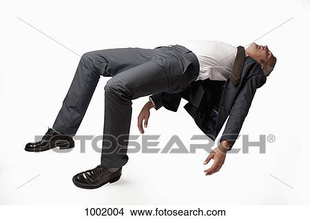 A sleeping businessman in mid-air, studio shot View Large Photo Image Picture - A sleeping businessman in mid-air, studio shot. Fotosearch