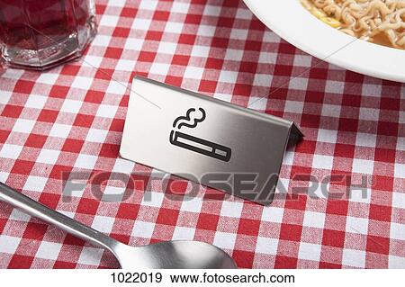 A smoking sign on a restaurant table View Large Photo Image Stock Photo - A smoking sign on a restaurant table. Fotosearch