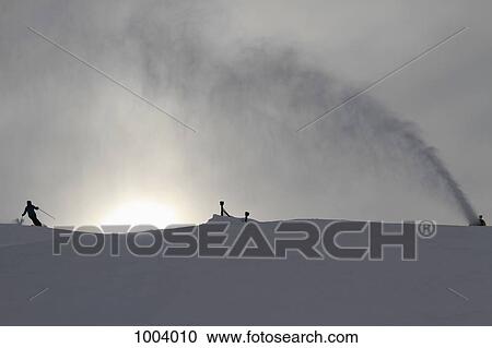 A snow machine spraying snow by a skier on a ski slope View Large Photo Image Stock Image - A snow machine spraying snow by a skier on a ski slope. Fotosearch