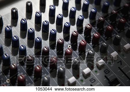 A sound mixing board, close-up, full frame View Large Photo Image Picture - A sound mixing board, close-up, full frame. Fotosearch