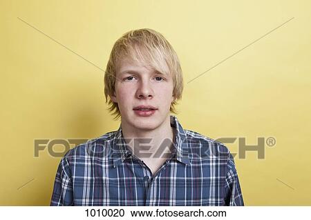 A teenage boy, portrait, studio shot View Large Photo Image Stock Image - A teenage boy, portrait, studio shot. Fotosearch