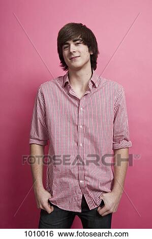 A teenage boy, portrait, studio shot View Large Photo Image Stock Photograph - A teenage boy, portrait, studio shot. Fotosearch