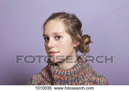 A teenage girl give a sideways glance to the camera, portrait, studio shot View Large Photo Image Stock Photography - A teenage girl give a sideways glance to the camera, portrait, studio shot. Fotosearch
