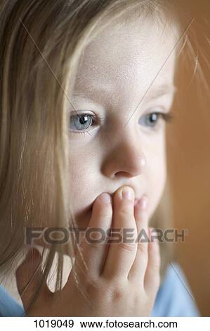Stock Photo - A toddler staring off camera. Fotosearch
