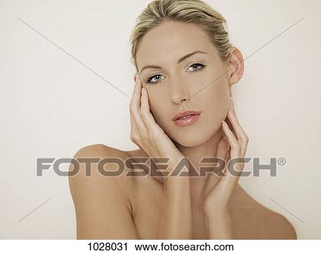 Stock Image - A woman flirting with the camera. Fotosearch