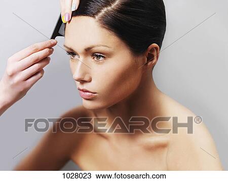 A woman getting her hair styled View Large Photo Image Stock Image - A woman getting her hair styled. Fotosearch