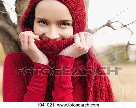 A woman looking playfully at the camera View Large Photo Image Stock Image - A woman looking playfully at the camera. Fotosearch
