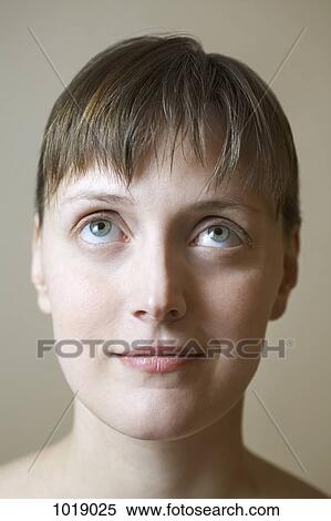A woman looking up contemplatively View Large Photo Image Stock Photography - A woman looking up contemplatively . Fotosearch