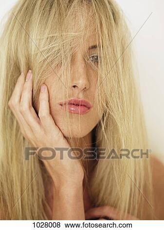 A woman with tousled hair, portrait View Large Photo Image Stock Photo - A woman with tousled hair, portrait. Fotosearch