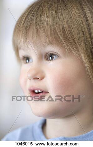 A young boy looking with wonder off camera View Large Photo Image Stock Photography - A young boy looking with wonder off camera. Fotosearch