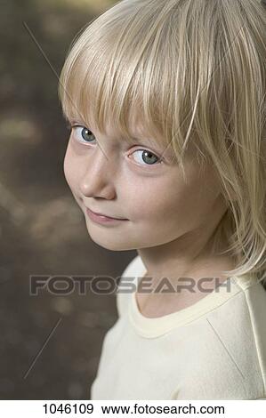 A young smiling girl, close-up View Large Photo Image Stock Photo - A young smiling girl, close-up. Fotosearch