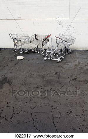 Stock Photo - Abandoned shopping carts in a parking lot. Fotosearch
