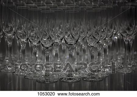 Abundance of champagne flutes in a row View Large Photo Image Stock Image - Abundance of champagne flutes in a row. Fotosearch