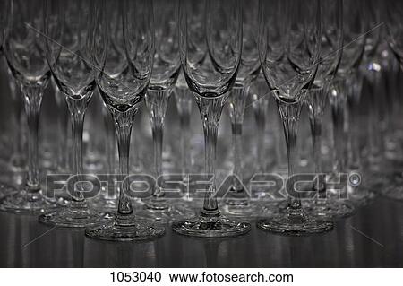 Abundance of champagne flutes in a row View Large Photo Image Stock Image - Abundance of champagne flutes in a row. Fotosearch
