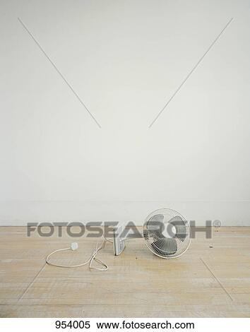 An electric fan lying on its side View Large Photo Image Stock Photography - An electric fan lying on its side. Fotosearch