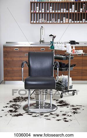 An empty barber chair with cut hair around it View Large Photo Image Picture - An empty barber chair with cut hair around it. Fotosearch