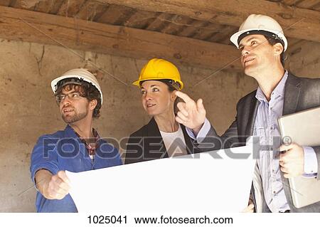 Architects and a building contractor at a building site View Large Photo Image Stock Image - Architects and a building contractor at a building site. Fotosearch