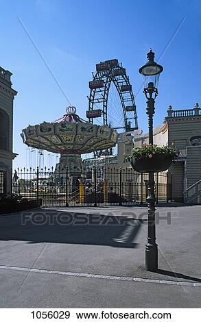 Austria, Vienna, Prater park amusement park rides with lamp post in foreground View Large Photo Image Stock Photo - Austria, Vienna, Prater park amusement park rides with lamp post in foreground. Fotosearch