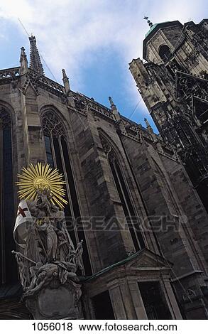 Austria, Vienna, St Stephen's Cathedral with statue of St Francis under a sunburst in foreground View Large Photo Image Stock Photo - Austria, Vienna, St Stephen's Cathedral with statue of St Francis under a sunburst in foreground. Fotosearch