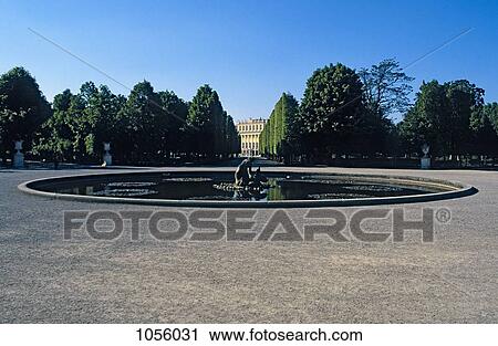 Austria, Vienna, water fountain with Schonbrunn Palace seen far in the background between trees View Large Photo Image Stock Image - Austria, Vienna, water fountain with Schonbrunn Palace seen far in the background between trees. Fotosearch