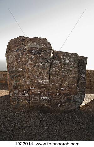 Boulder with written messages on it and surrounding wall in the background View Large Photo Image Picture - Boulder with written messages on it and surrounding wall in the background. Fotosearch