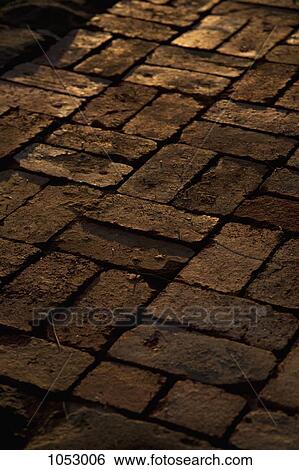 Brick road at night, full frame, close-up View Large Photo Image Stock Photograph - Brick road at night, full frame, close-up. Fotosearch