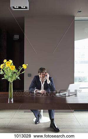Businessman at home on mobile phone. View Large Photo Image Stock Photo - Businessman at home on mobile phone.. Fotosearch