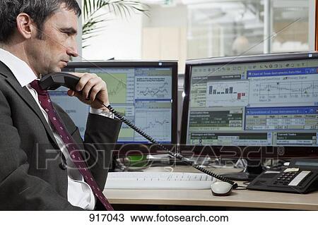 Stock Image - Businessman contemplates stock. Fotosearch