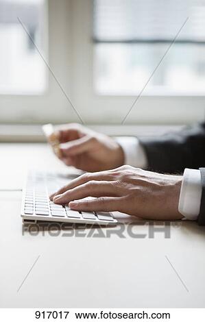 Stock Photo - Businessman hands typing. Fotosearch