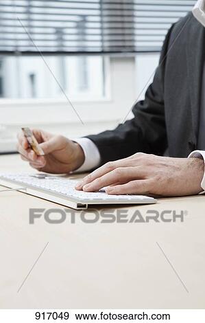 Businessman hands typing View Large Photo Image Stock Photo - Businessman hands typing. Fotosearch
