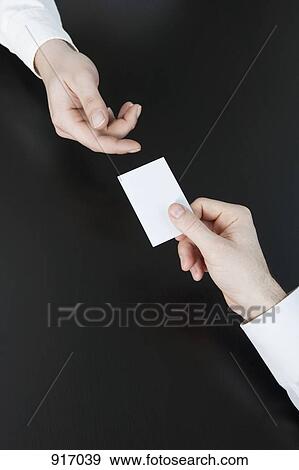 Businessmen pass the card View Large Photo Image Stock Photo - Businessmen pass the card. Fotosearch