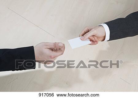 Businessmen pass the card View Large Photo Image Stock Photograph - Businessmen pass the card. Fotosearch