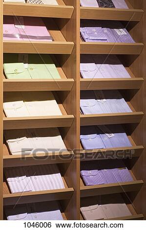Button down shirts on display in a menswear store View Large Photo Image Stock Photograph - Button down shirts on display in a menswear store. Fotosearch