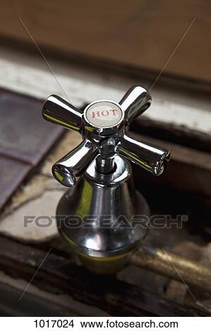 Picture - Close-up of a HOT tap. Fotosearch